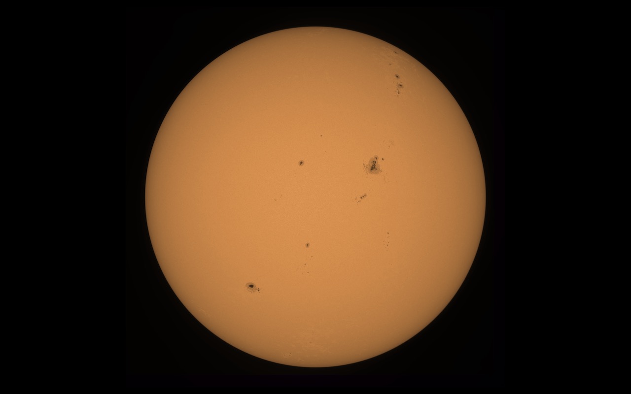 Full disk image of the Sun showing surface detail and active regions.